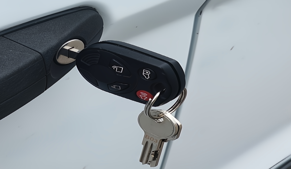  Image of Tire Pressure Monitor tool reading the sensor inside the tire representing TPMS diagnosis. 