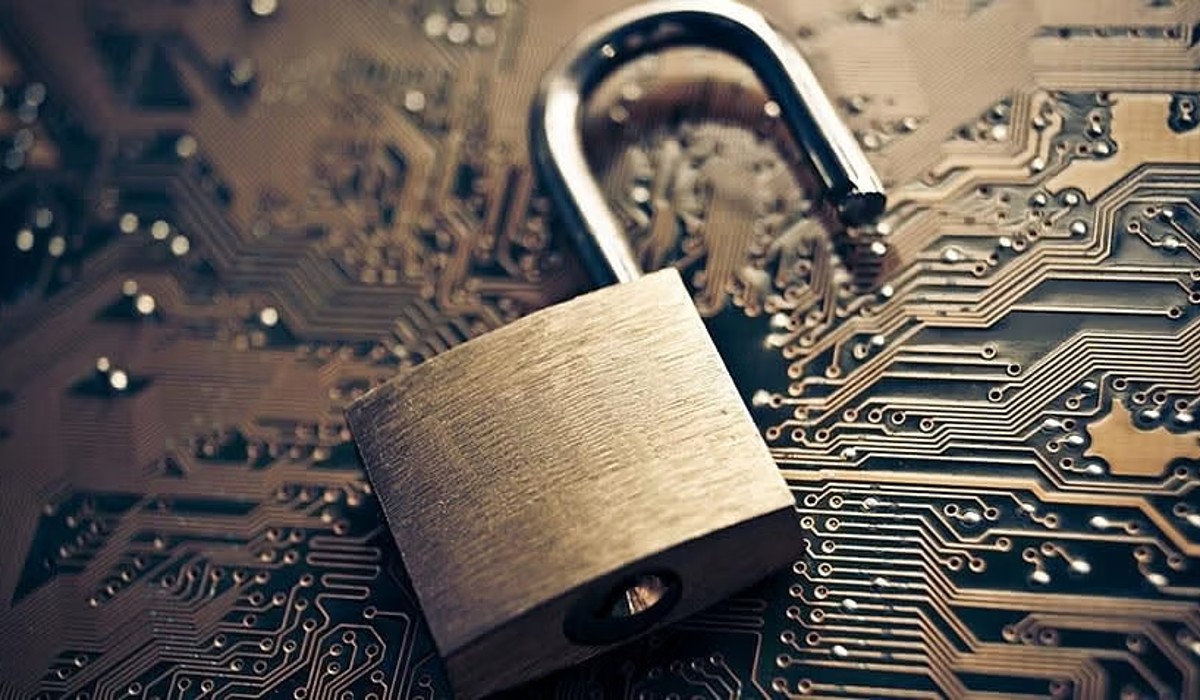  Image of open lock laying on top of circuit board to represent gaining access to security codes. 
